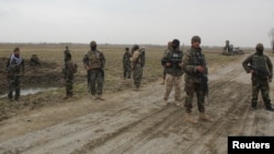 Afghan National Army (ANA) soldiers arrive at the site of last night clashes between Taliban and Afghan forces in Kunduz, Afghanistan March 4, 2020 REUTERS/Stringer NO RESALES. NO ARCHIVES.