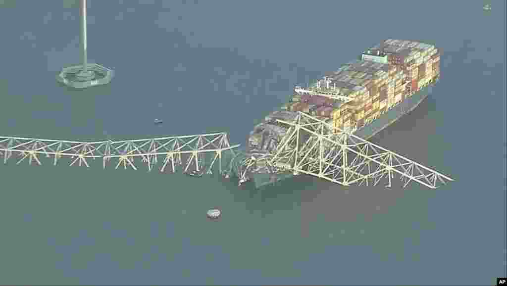 Parts of the Francis Scott Key Bridge remain after a container ship collided with one of the bridge&rsquo;s supports, March 26, 2024 in Baltimore.&nbsp;(WJLA via AP)