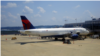 A Delta Air Lines jet is parked at Reagan National Airport in Washington, DC. (Photo: Diaa Bekheet)