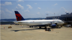 A Delta Air Lines jet is parked at Reagan National Airport in Washington, DC. (Photo: Diaa Bekheet)