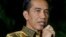FILE - Indonesian President-elect Joko Widodo speaks during a press conference at his residence in Jakarta, Indonesia.