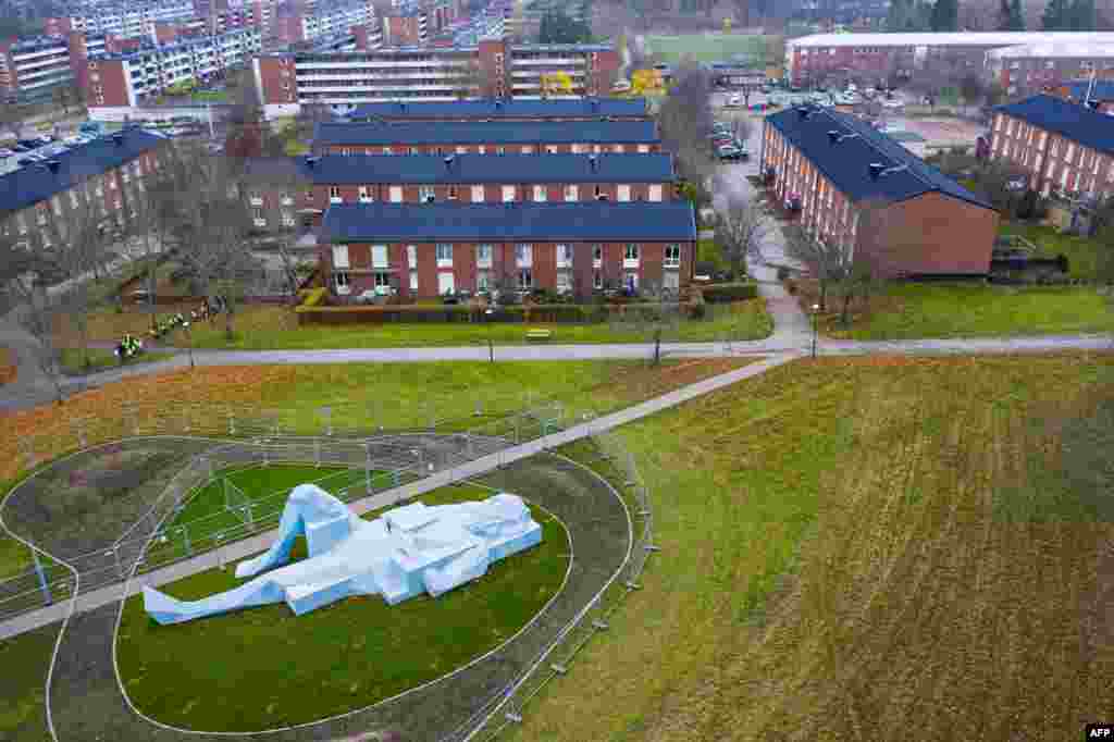 This aerial view photo shows one of two &quot;Varbergs Giants&quot;, a giant sculpture by French artist Xavier Veilhan displayed in Varberg, south of Stockholm, Sweden.