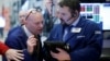 Traders work on the floor of the New York Stock Exchange in New York City, Dec. 16, 2016. 