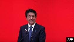 FILE - Japan's Prime Minister Shinzo Abe delivers a speech in Tokyo, July 24, 2019. 