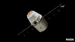 SpaceX Dragon is pictured about 30 meters from the International Space Station before being captured minutes later at its capture point of 10 meters from the station. ( NASA TV)