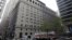 Pedestrians pass the Federal Reserve Building Wednesday, Oct. 17, 2012, in New York 