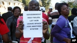 Activists demonstrate in the streets of Mbabane on July 21, 2011 to draw attention to their government's dwindling supply of anti-retroviral drugs, as Swaziland is the world's highest HIV infection rate. They delivered petitions to the Health and Finance 