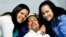 Venezuela's President Hugo Chavez, center, poses for a photo with his daughters in Havana, Cuba, Thursday, Feb. 14, 2013 (Photo released by Venezuela govt)