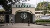 FILE - A local resident walks past the Economic Community of West African States (ECOWAS) Lagos office in Lagos, Nigeria, on Sept. 24, 2024.