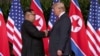 Trump-Kim Berjabat Tangan sebelum Lakukan Perundingan di Singapura