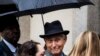 FILE - Roger Stone, a longtime Republican provocateur and confidant of President Donald Trump, waits in line at the federal court in Washington, Nov. 12, 2019.