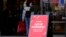 Hiring sign is displayed outside of a retail store in Vernon Hills, Ill., Nov. 13, 2021.
