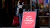 Hiring sign is displayed outside of a retail store in Vernon Hills, Ill., Nov. 13, 2021.