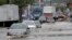 FILE - Vehicles drive on floodwaters, May 5, 2017, in Newark, N.J. Heavy rains caused flooding in New York City and flight delays in the region.