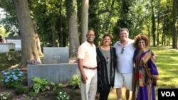 Reporter Chris Simkins, second from right, meets with members of the Tucker family at the first African cemetery in colonial America, in Hampton, Virginia. 