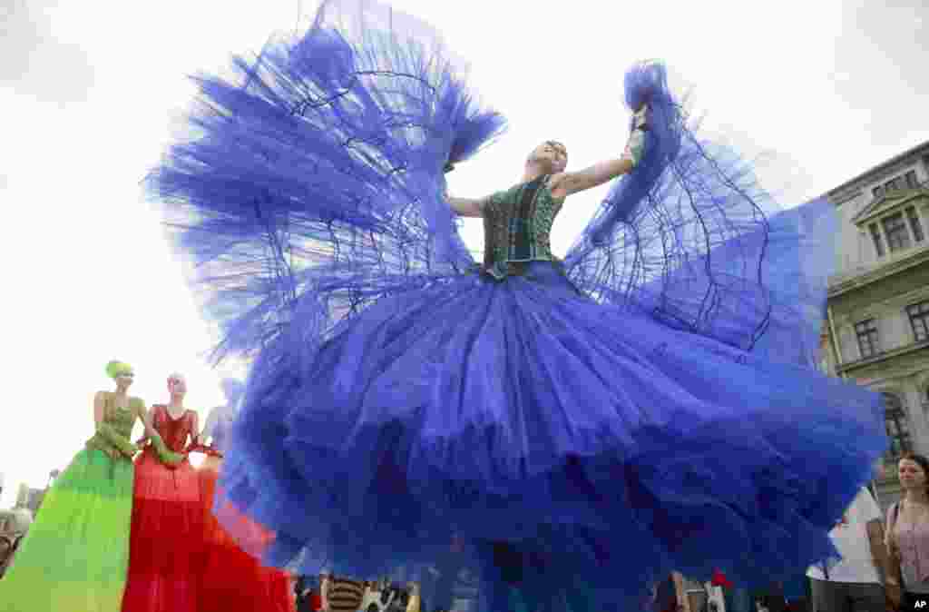 The Ballerinas street art theater company of the Netherlands dance during the B-Fit in the street festival in Bucharest, Romania, June 9, 2016.