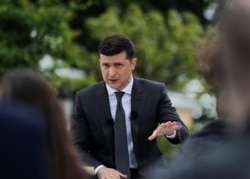 FILE - Ukrainian President Volodymyr Zelenskiy IS pictured during a news conference in Kyiv.