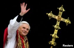 FILE PHOTO: Pope Benedict XVI, Cardinal Joseph Ratzinger of Germany, waves from a balcony of St. Peter's Basilic..