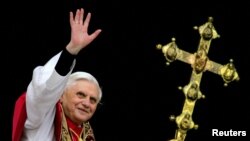 FILE - Pope Benedict XVI, Cardinal Joseph Ratzinger of Germany, waves from a balcony of St. Peter's Basilica in the Vatican after being elected by the conclave of cardinals, April 19, 2005.