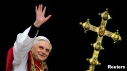 FILE PHOTO: Pope Benedict XVI, Cardinal Joseph Ratzinger of Germany, waves from a balcony of St. Peter's Basilic..