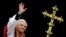 FILE PHOTO: Pope Benedict XVI, Cardinal Joseph Ratzinger of Germany, waves from a balcony of St. Peter's Basilic..