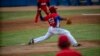 FILE - Cuba's pitcher Yoanni Yera Montalvo throws the ball during a training session at the Estadio Latinoamericano in Havana, Cuba, May 18, 2021. 