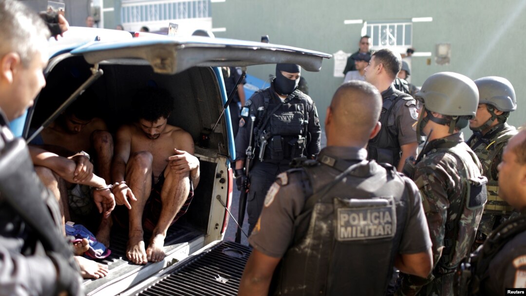 Suspects are arrested after violent clashes with Brazilian Army soldiers in Rio de Janeiro, Brazil, Aug. 20, 2018.