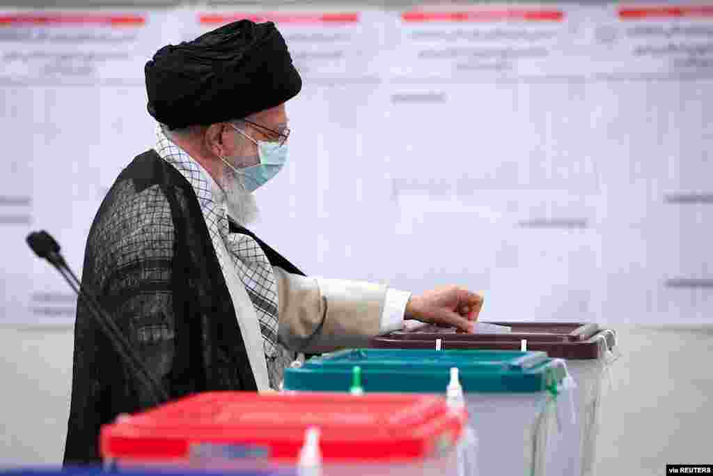 Iran&#39;s Supreme Leader Ayatollah Ali Khamenei casts his vote during Iranian presidential election in Tehran, Iran. (Official Khamenei Website/Handout via Reuters)