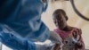 FILE - A health worker attends to a patient with mpox at a treatment center in Munigi, Democratic Republic of Congo, on Aug. 19, 2024.