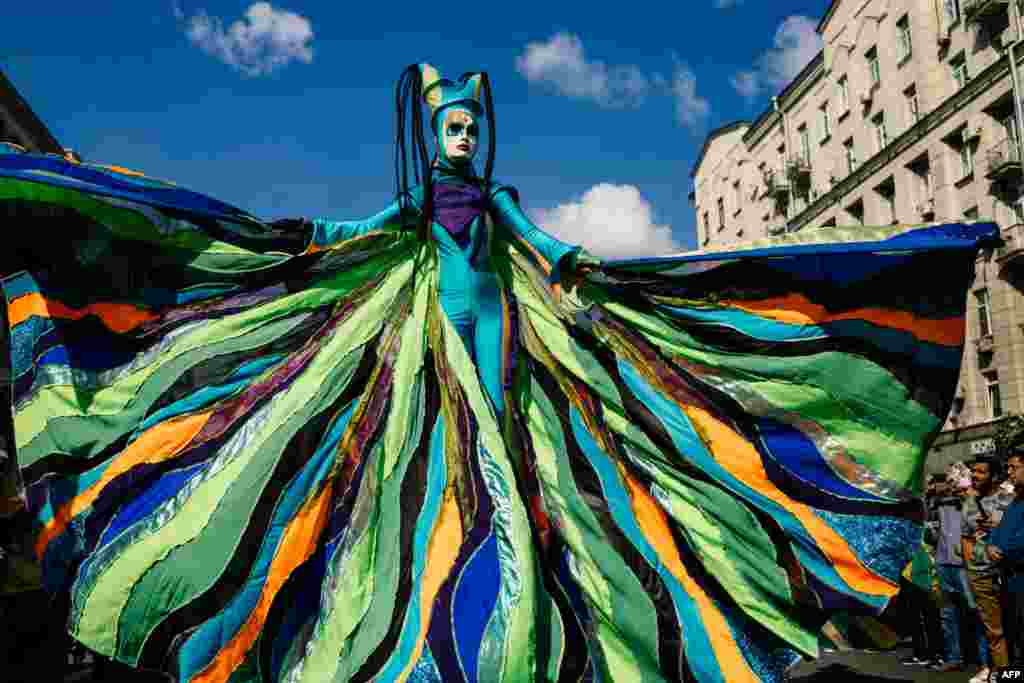 An artist performs on Tverskaya street during celebrations marking the 872nd anniversary of the city of Moscow, Sept. 7, 2019, in Moscow, Russia.