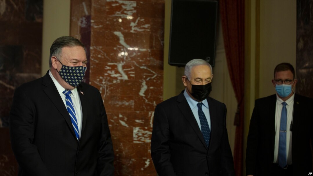 US Secretary of State Mike Pompeo, left, and Israeli Prime Minister Benjamin Netanyahu leave after making a joint statement in Jerusalem, Nov. 19, 2020. 