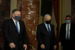 U.S. Secretary of State Mike Pompeo, left, and Israeli Prime Minister Benjamin Netanyahu leave after making a joint statement in Jerusalem, Nov. 19, 2020.