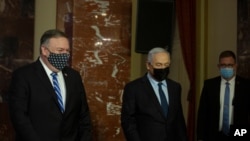 Menteri Luar Negeri AS Mike Pompeo (kiri) dan Perdana Menteri Israel Benjamin Netanyahu di Yerusalem, Kamis, 19 November 2020. (AP Photo / Maya Alleruzzo, Pool)
