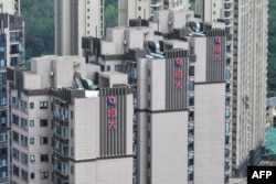 The Evergrande logo is seen on residential buildings in Nanjing, in China’s eastern Jiangsu province on August 18, 2023.