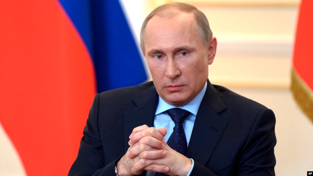 President Vladimir Putin answers journalists' questions on current situation in Ukraine at the Novo-Ogaryovo presidential residence outside Moscow, March 4, 2014. 
