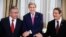 From left: Turkish Cypriot Leader Mustafa Akinci, U.S. Secretary of State John Kerry and Cyprus President Nicos Anastasiades shake hands before a dinner at the UNFICYP Residence, in Nicosia, Dec. 3, 2015.