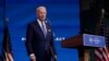 President-elect Joe Biden pauses as he leaves to listen to a reporter's shouted question at The Queen Theater in Wilmington, Del., Dec 22, 2020. 