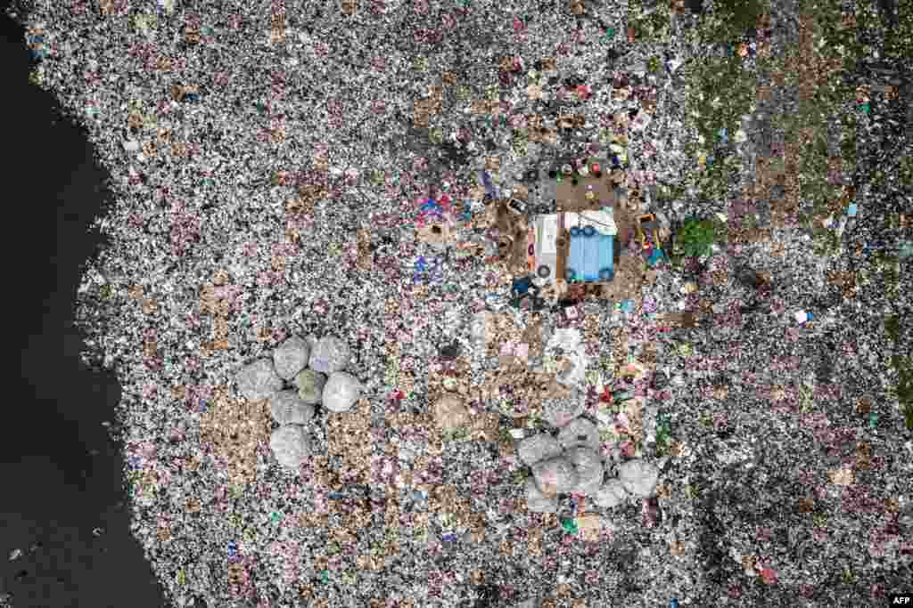 This aerial view shows a portion of the waste clogged lagoon along a slum in the Oworoshoki district in mainland Lagos, Nigeria, Sept. 29, 2024.