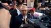 FILE - Turkish Ambassador Serdar Kilic, center, speaks to reporters and supporters near the White House in Washington, May 15, 2017. 