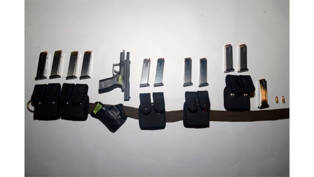 This photo provided by the Santa Clara County (Calif.) Sheriff's Office shows guns and ammunition magazines found at the residence of Samuel Cassidy, the suspect in the May 26, 2021, shooting at a San Jose rail station.