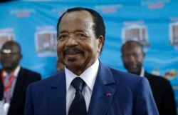 FILE - In this Oct. 7, 2018 photo, Cameroon's incumbent President Paul Biya waits to casts his vote during the presidential elections in Yaounde, Cameroon.