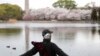 A man stretches at the Yuyuantan Park in Beijing, China.