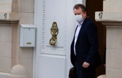 Britain's chief negotiator David Frost leaves the UK ambassadors residence in Brussels, Dec. 21, 2020.