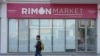 A man walks past Rimon Market, a kosher grocery store managed by the late Rabbi Zvi Kogan, in Dubai, United Arab Emirates, Nov. 24, 2024.