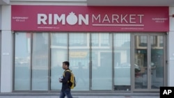 A man walks past Rimon Market, a kosher grocery store managed by the late Rabbi Zvi Kogan, in Dubai, United Arab Emirates, Nov. 24, 2024.