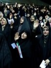 FILE - Veiled Iranian women attend a ceremony in support of the observance of the Islamic dress code for women, in Tehran, Iran, July 11, 2019. 