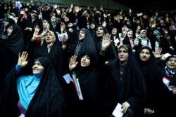 FILE - Veiled Iranian women attend a ceremony in support of the observance of the Islamic dress code for women, in Tehran, Iran, July 11, 2019.