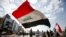 FILE - University students attend a protest against the U.S. and Iran interventions, in Basra, Iraq, January 8, 2020.