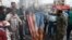 FILE - Protesters burn a representation of the U.S. flag during a rally against the U.S.'s decision to designate Iran's powerful Revolutionary Guards as a foreign terrorist organization, in Tehran, April 12, 2019. 