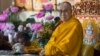 Tibetan spiritual leader the Dalai Lama sits on his ceremonial chair as he presides over the inauguration of the Namgyal Monastery School in Dharmsala, India, Nov. 2, 2017.